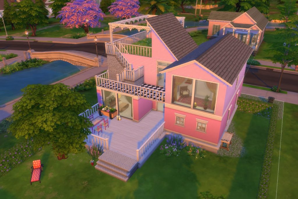 Modernes rosa Haus mit mehreren Terrassen, großen Fenstern und Außentreppe in einer grünen Wohnsiedlung am Wasser